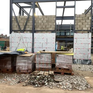 Commercial steel frame build with inner blockwork walls and insulation under construction in Hull.