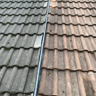 Neatly installed dry valley trough separating two contrasting sets of concrete roof tiles in Hull.