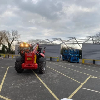 Rear perspective of a steel frame structure with grey cladding panel installation in Hull.